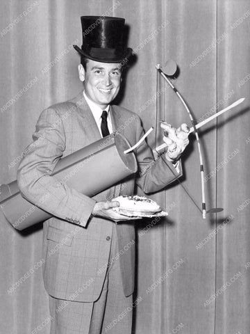 Bob Barker a top hat, giant firecracker, a pie and a bow and arrow 8b20-16708