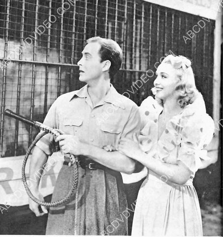 Carole Landis gets tour of lion cages 8b20-17065
