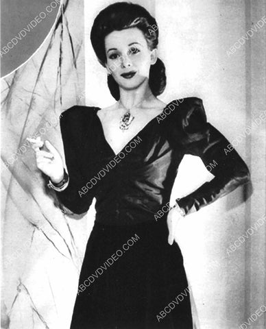 Carole Landis smokes a cigarette 8b20-17066