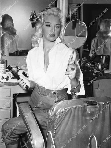 Diana Dors checks her new hair-do 8b20-17316