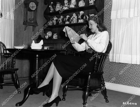 candid Barbara Stanwyck going over some business 8b20-17433