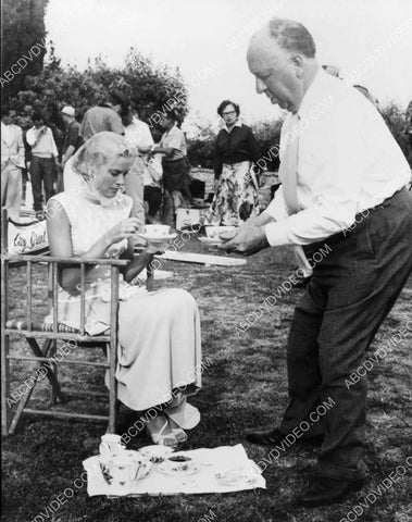 candid Grace Kelly Alfred Hitchcock have some tea on set To Catch a Thief 8b20-17599