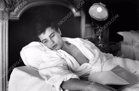 young Alain Delon reading in bed 8b20-1823