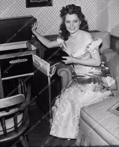 candid Alexis Smith listens to records in her dressing room 8b20-1884