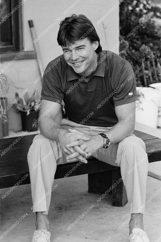 casual Jan-Michael Vincent sitting on a bench 8b20-19125