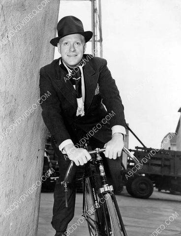 Nelson Eddy on his bicycle on the studio backlot 8b20-19999