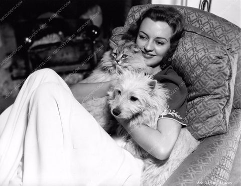 Andrea Leeds relaxes chaise lounge with her two dogs 8b20-1999