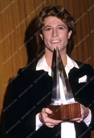 Andy Gibb proudly displays his new award 8b20-2065