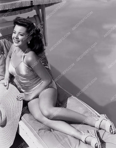 Ann Rutherford does a little sunbathing by the swimming pool 8b20-2394