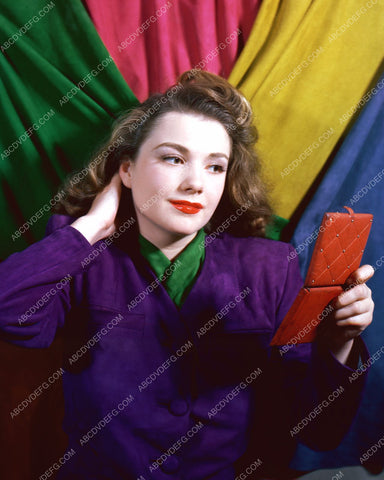 Anne Baxter does a quick makeup check 8b20-2457