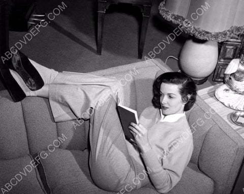 Jane Russell relaxes and takes in a good book 8b20-2650