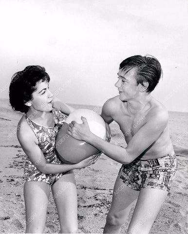 Annette Funicello wrestles Tommy Kirk for sole posession of beachball 8b20-2913