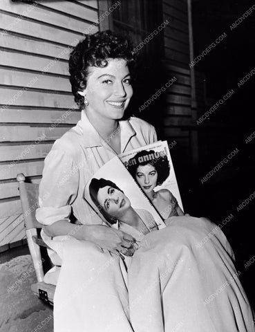 candid Ava Gardner reading a Hollywood gossip magazine 8b20-3021