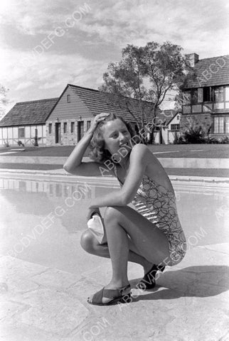 Barbara Stanwyck in swimwear by the pool in back yard 8b20-3484