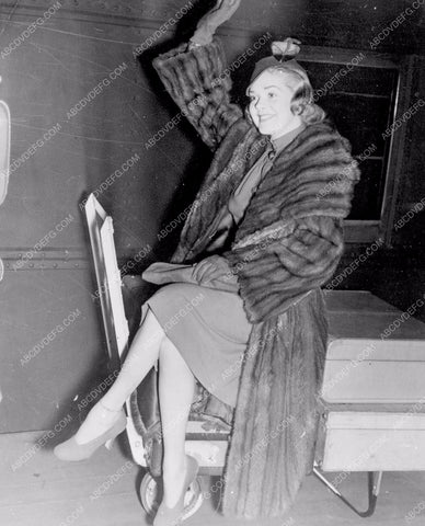 candid Alice Faye sitting on luggage going through customs maybe 8b20-3682