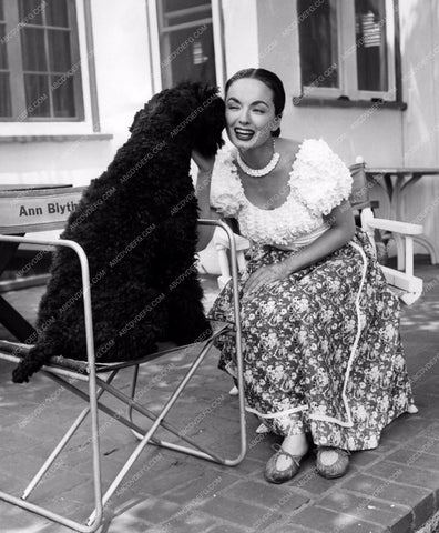 Ann Blyth kisses her dog between takes 8b20-4029