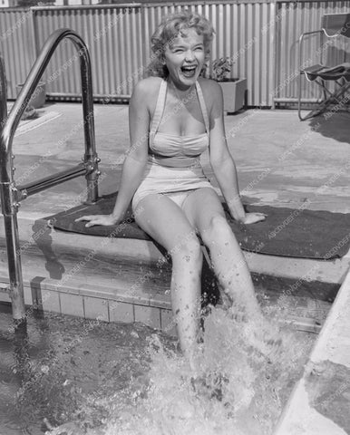 playful Anne Francis kicking and splashing her feet in the pool 8b20-4239