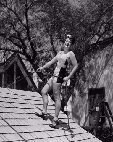 physically competant Anne Gwynne does a little roof repair in swimwear 8b20-4291