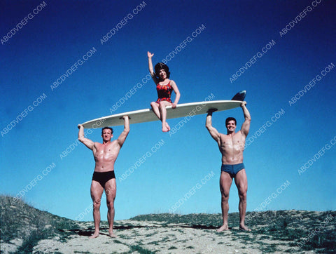two muscle man beefecakes lift Annette Funicello in celebration 8b20-4376