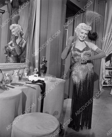 Betty Grable puts on a little perfume at the makeup table 8b20-4802