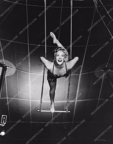 athletic Betty Hutton practices on circus trapeze swing 8b20-4914