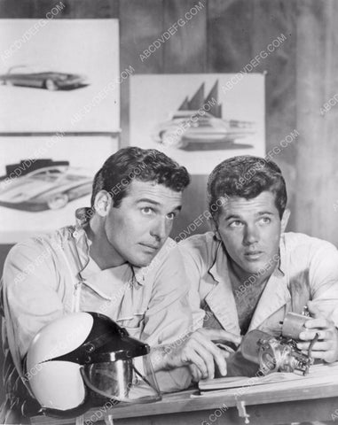 Brian Kelly w cool futuristic cars on the wall 8b20-5185