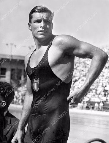 studly and good looking Buster Crabbe getting out of the pool 8b20-5630