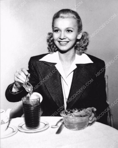 Carole Landis enjoys a glass of iced tea 8b20-5990