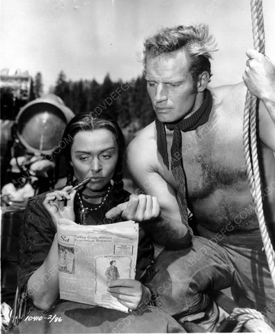 Charlton Heston behind the scenes doing crossword puzzle maybe 8b20-7024