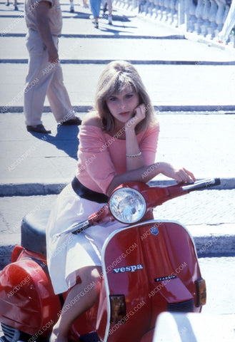 some sexy babe on Vespa motor scooter 8b20-8028