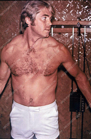 studly and rugged Dennis Cole at the exercise stations 8b20-8163