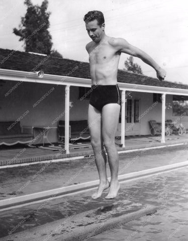 Dick Powell in swimsuit about to bust a move off the diving board 8b20-8195