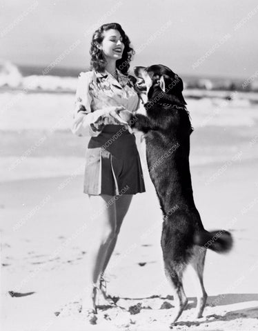 Ava Gardner plays with her dog on the beach 8b20-8509