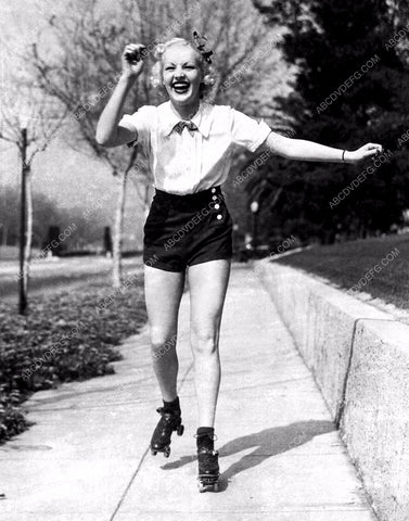 Betty Grable having fun roller skating down the sidewalk 8b20-8932