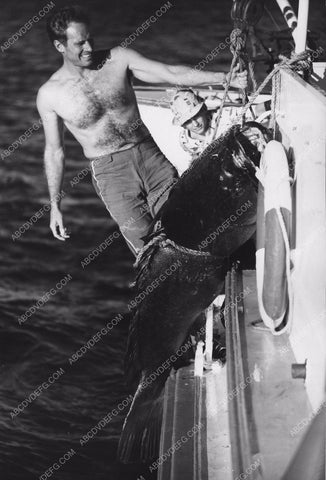 Charlton Heston catches one heck of a big fish 8b20-9051