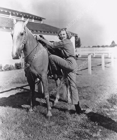 Carole Lombard climbing on her horse 8b20-9130