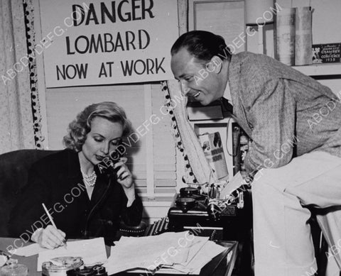 Carole Lombard in her office Russell Birdwell looks on 8b20-9135