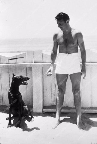 handsome Geroge brent playing with his dog at the beach 8b20-9512