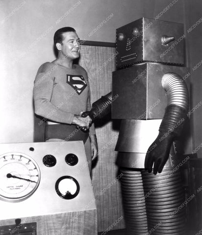 George Reeves as Superman shakes hands with a robot 8b20-9893