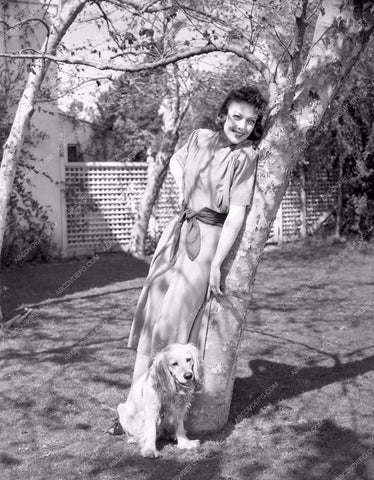 Loretta Young in garden with dog lyoung-08