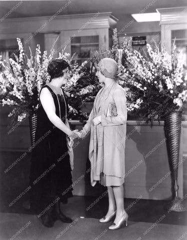 Mary Pickford and friend and large floral arrangements mpick-21