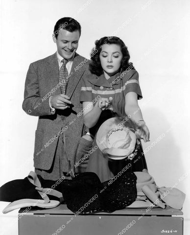 crp-10616 1942 Ann Rutherford, Robert Sterling pick out some hats film This Time for Keeps crp-10616