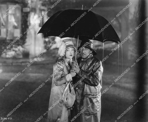 crp-11768 1927 Marion Davies under umbrella in the rain silent film Quality Street crp-11768