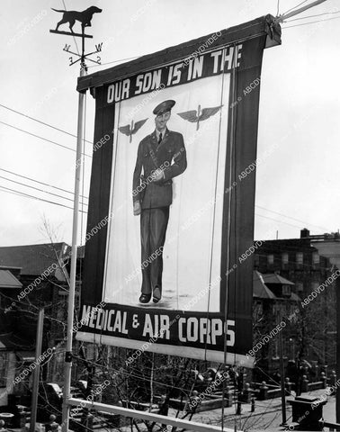 crp-11962 1943 news photo WWII propaganda recruitment poster of John Blacie Jr goes up by parents home in Brooklyn NY crp-11962