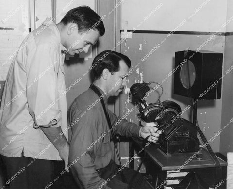 crp-12322 1942 candid Frankie Albert w Columbia Studios sound cutter Weldon Hancock at moviola machine film The Spirit of Stanford crp-12322