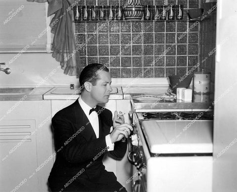 crp-13630 1938 Robert Montgomery lights a smoke off the stove film The First Hundred Years crp-13630