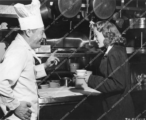 crp-14341 1946 candid Hollywood Chef Emil makes "Evelyn Keyes Soup" in kitchen w Ms Keyes crp-14341