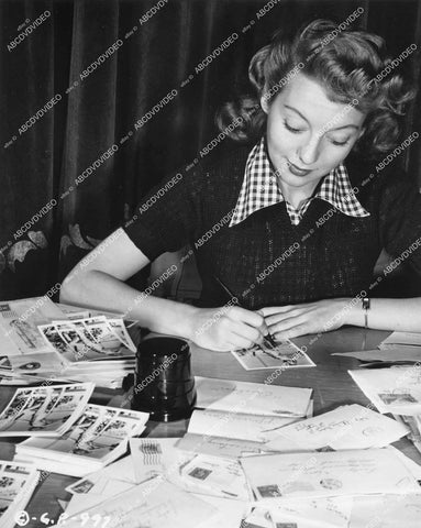 crp-14529 1946 beautiful Evelyn Keyes at her desk answering fan mail film The Jolson Story crp-14529