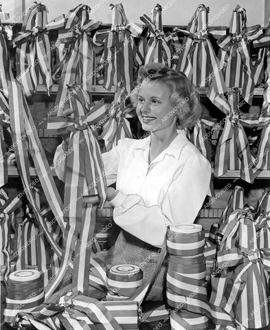 crp-15177 1942 WWII Betty Andrews makes bunting for bottles to christen Liberty Ships crp-15177