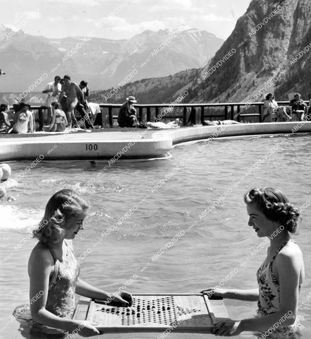 crp-15211 1947 Banff Canada Springs pool Elba Hooper, Marion Charlton play Chinese checkers in swimming pool crp-15211